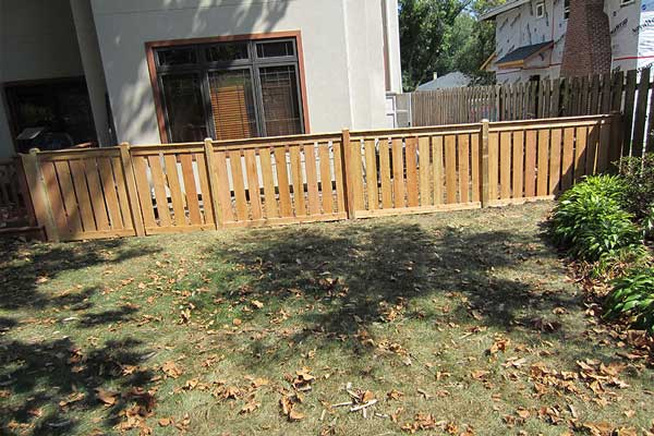 Good Neighbor With Privacy Wooden Fencing at the backyard. A wooden fence surrounds a backyard in Batavia, IL, enhancing the home's outdoor aesthetics