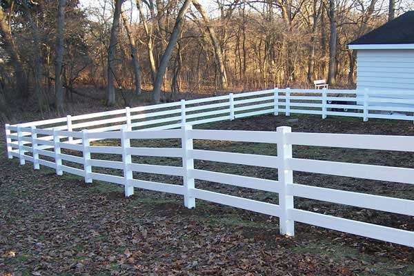 White fence at the backyard. White fence at the backyard.