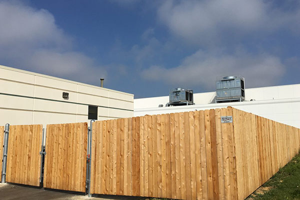 Wooden fence with chain-linked at backyard.