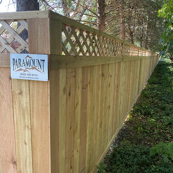 A fence with a sign labeled Paramount in Batavia, IL