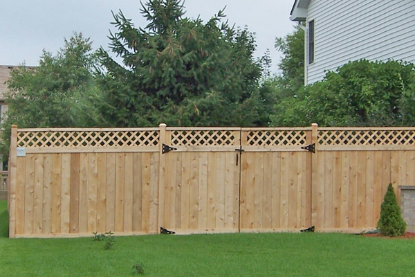 Paramount wood fence in lawn 