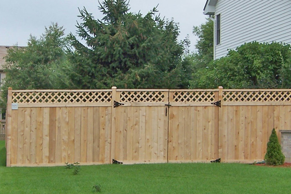 Wood Traditional Fence with Lattice by Paramount Fence Paramount wood fence in lawn